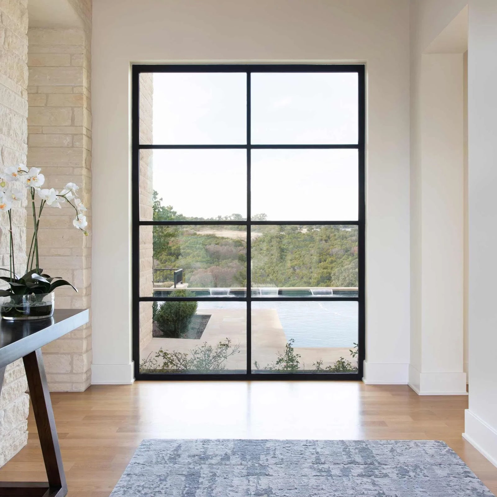 exterior steel framed glass wall with square top and black frame