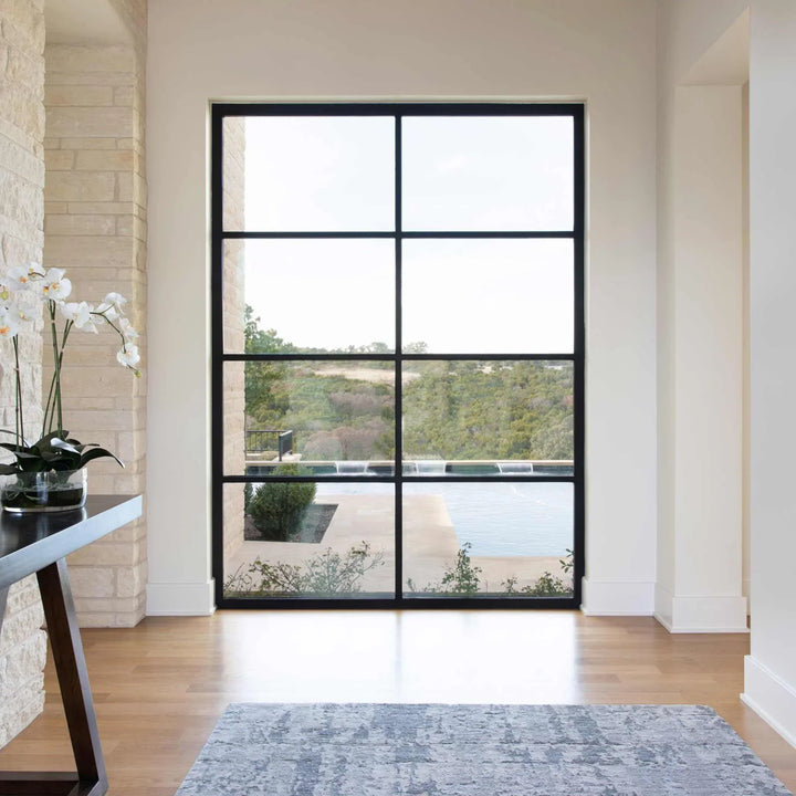 exterior steel framed glass wall with square top and black frame