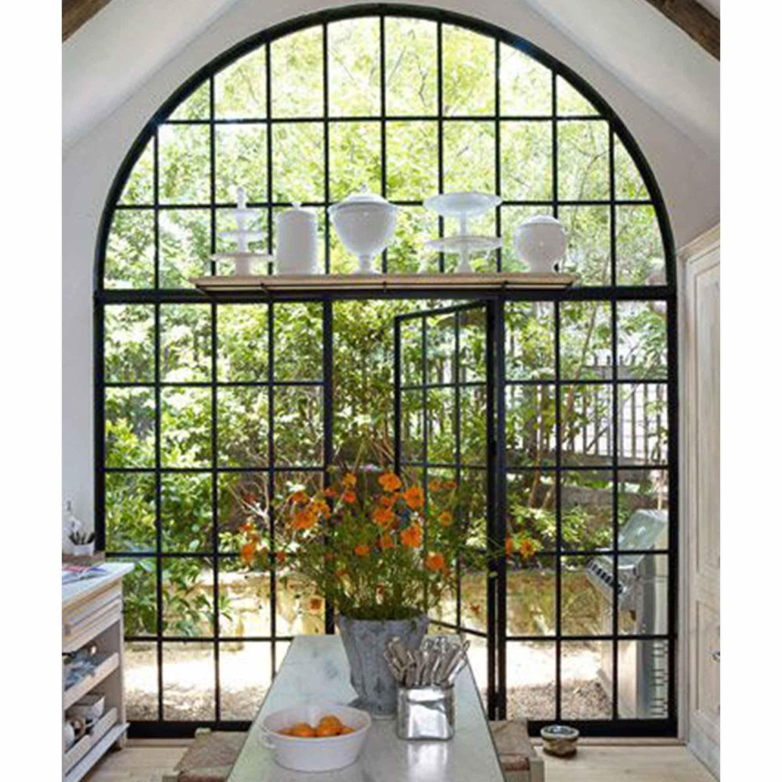 black iron french single door with two big sidelights, big round transom and and 15-lite glass