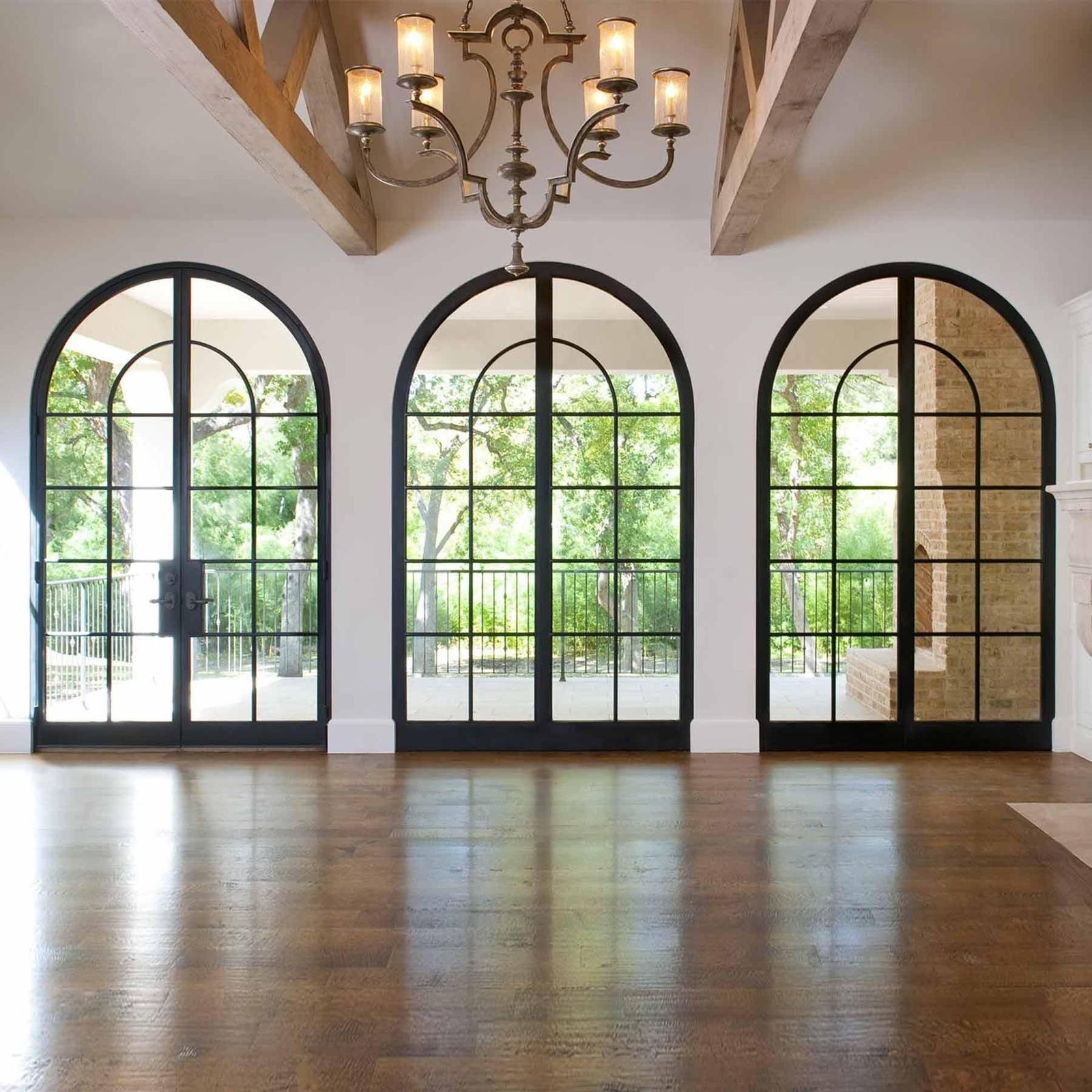 custom steel fixed glass sidelight wall with round top and black frame