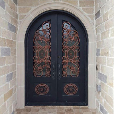 iron double exterior door with round top and kickplate