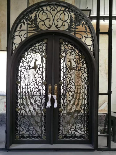 iron double exterior door with round top and transom