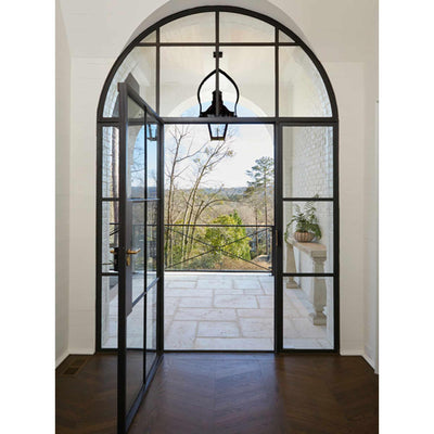 iron french double door with round transom and clear glass
